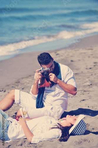 young couple enjoying  picnic on the beach © .shock