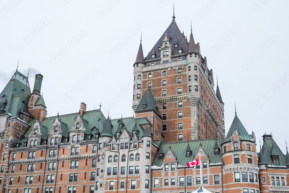  View of Frontenac Castel (Chateau de Frontenac, in French) in winter under the snow. The Château Frontenac is a grand hotel in Quebec City.
