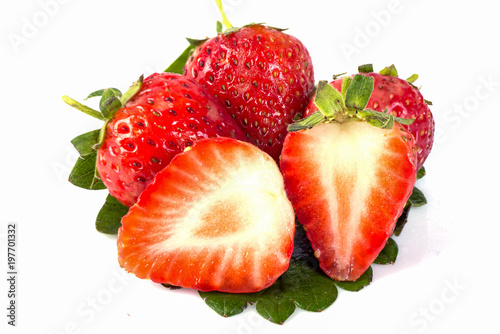strawberry with sliced half and leaves isolated on white background