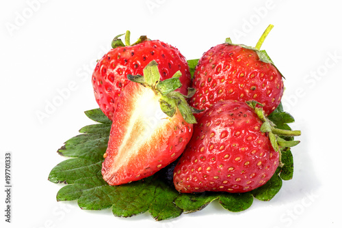strawberry with sliced half and leaves isolated on white background