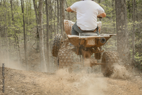 four wheeler driving up hill