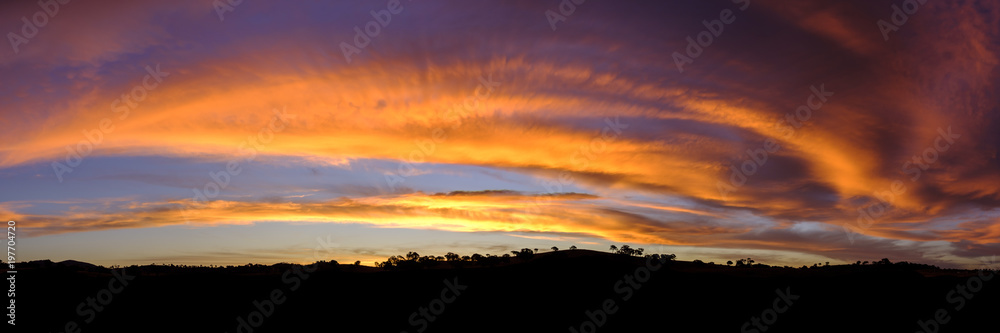 Firey Sunset behind hills. Googong, NSW