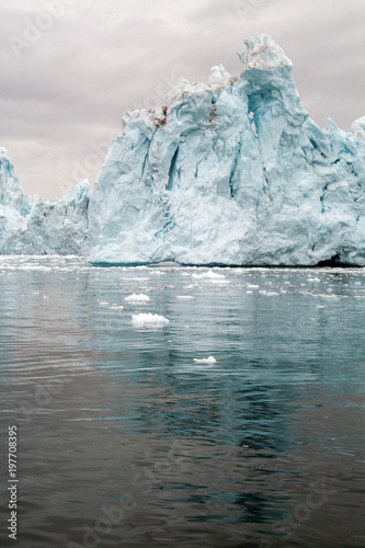 Giant icebergs and ice mountains on the west coast of Greenland in the Arctic Ocean