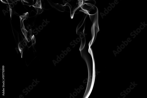 Smoke the white incense on a black background. darkness concept