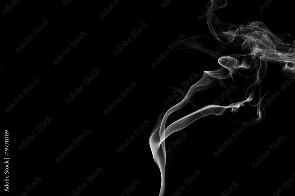 Smoke the white incense on a black background. darkness concept Smoke the white incense on a black background. darkness concept