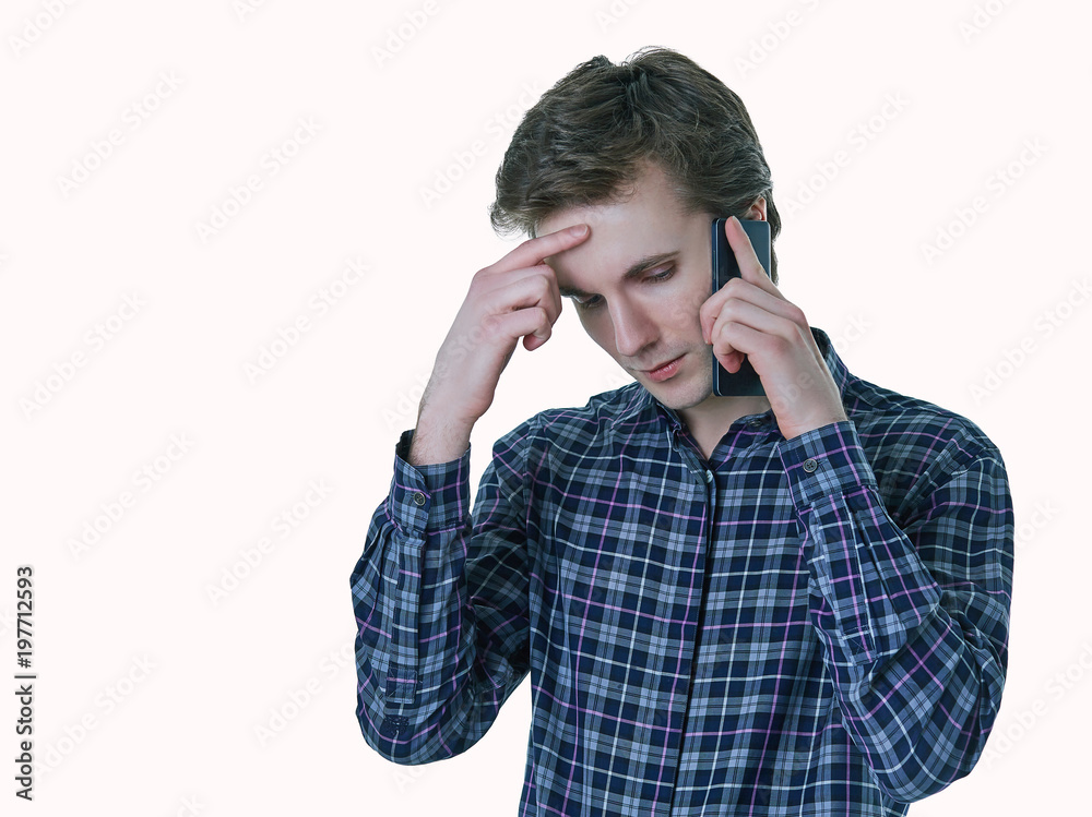 Closeup portrait of young stressed business man, corporate employee, student talking on cell phone. Closeup portrait of young stressed business man, corporate employee, student talking on cell phone.