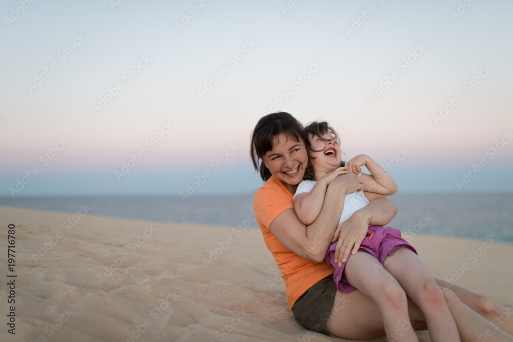 Laughing mother enjoys holiday with daughter