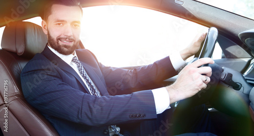 portrait of confident businessman driving a car © ASDF