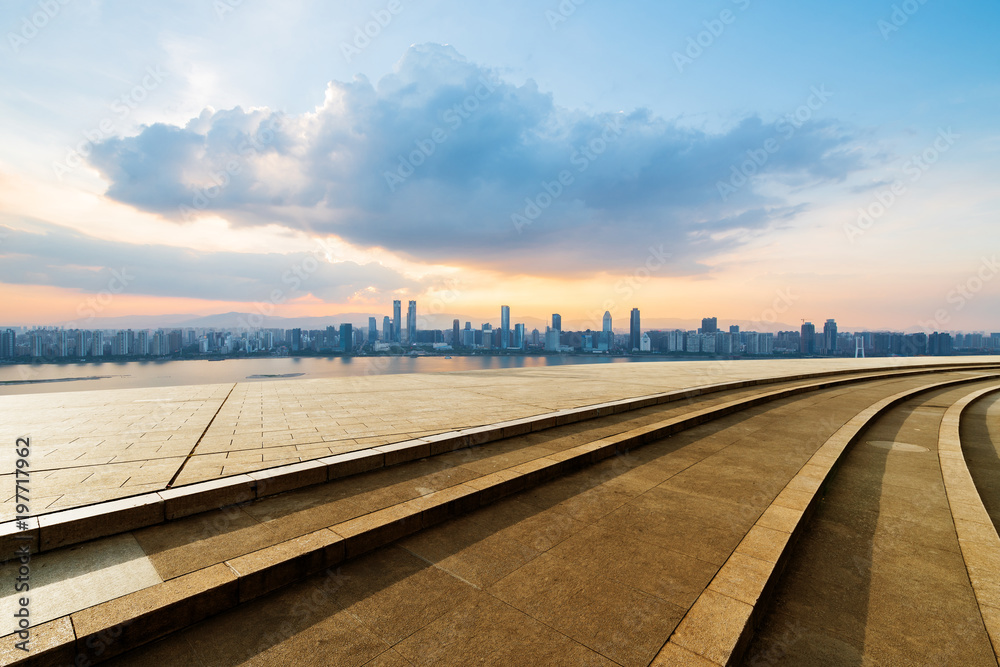 Fototapeta premium empty concrete floor and modern buildings in midtown of singapore in blue cloud sky