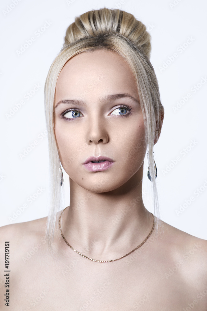 Young beautiful blond woman posing