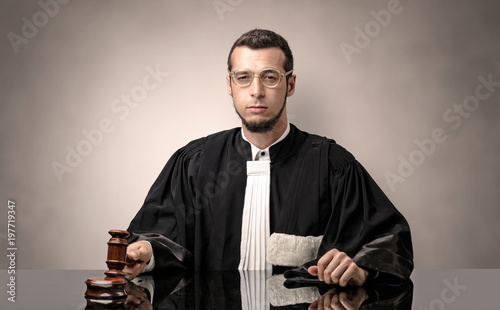 Oldscool young judge in gown photo