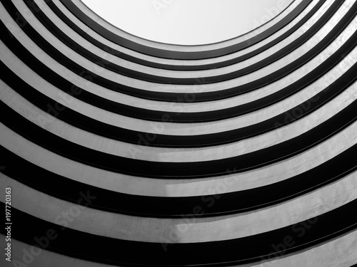 Fototapeta Naklejka Na Ścianę i Meble -  Looking up to sky from modern circle concrete building,Abstract layer of circle architecture