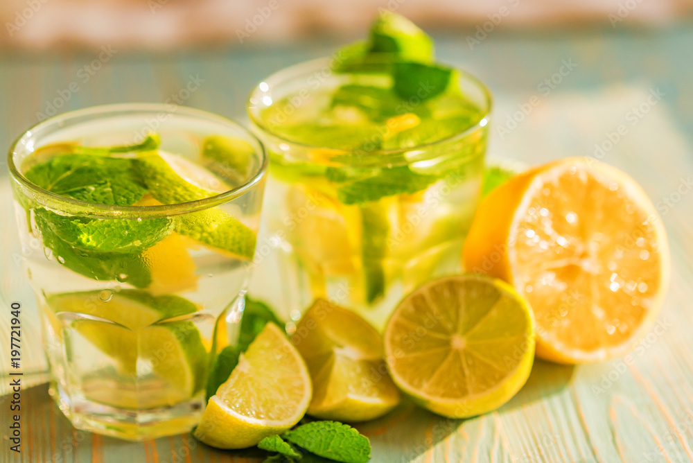 Lemonade or mojito cocktail with lemon and mint