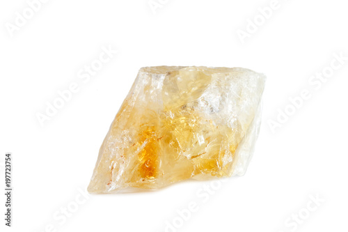 Macro shooting of natural gemstone. The raw mineral is citrine. Brazil. Isolated object on a white background.