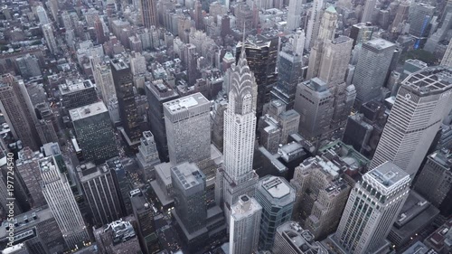 New York City aerial view of Midtown Manhattan orbiting the Chrysler Building at dusk photo