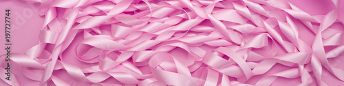 Banner delicate texture of satin ribbons of pink color.