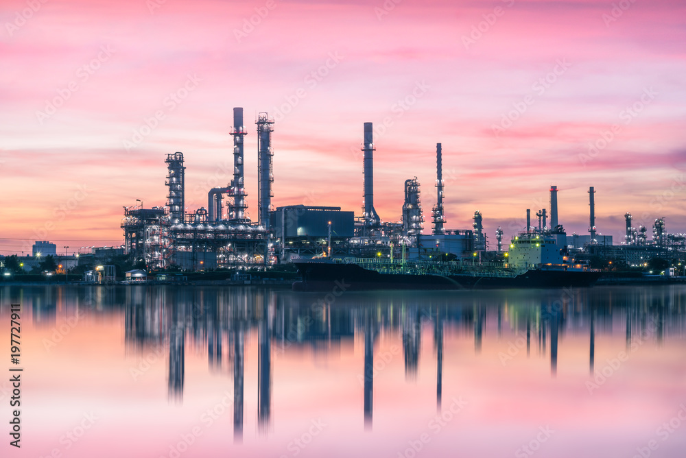 Oil Refinery Industry Plant at dramatic colorful sunrise dawn sky background.