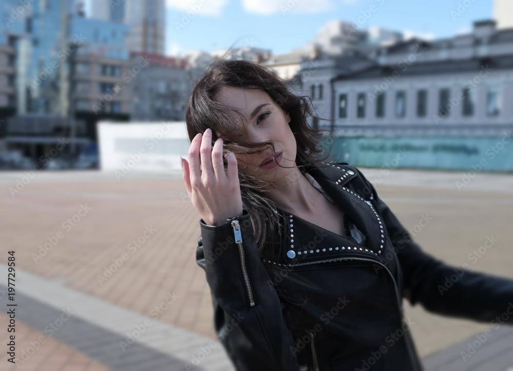 Fototapeta premium Handsome girl in black leather jacket