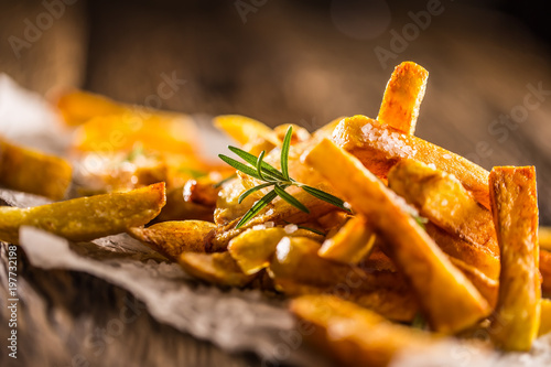 Fototapeta Potato Fries. Homemade potato fries with salt and rosemary