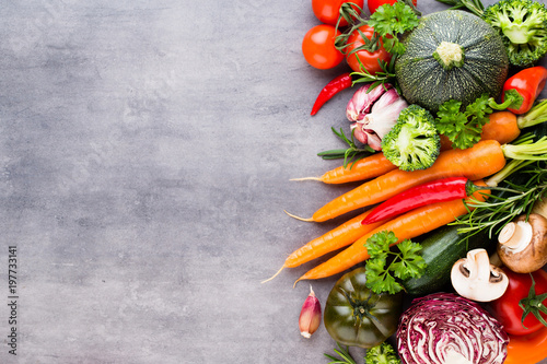 Flat lay of various colorful raw vegetables.