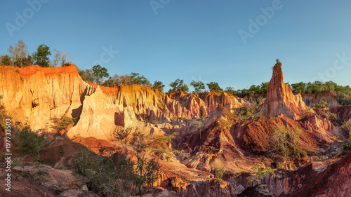 Marafa Depression (Hell's Kitchen canyon) with red cliffs and rocks in afteroon sunset light. Malindi, Kenya