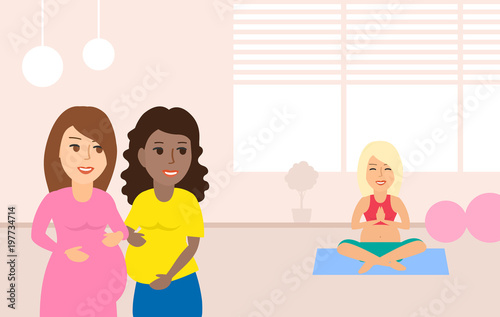 pregnant women in yoga class room