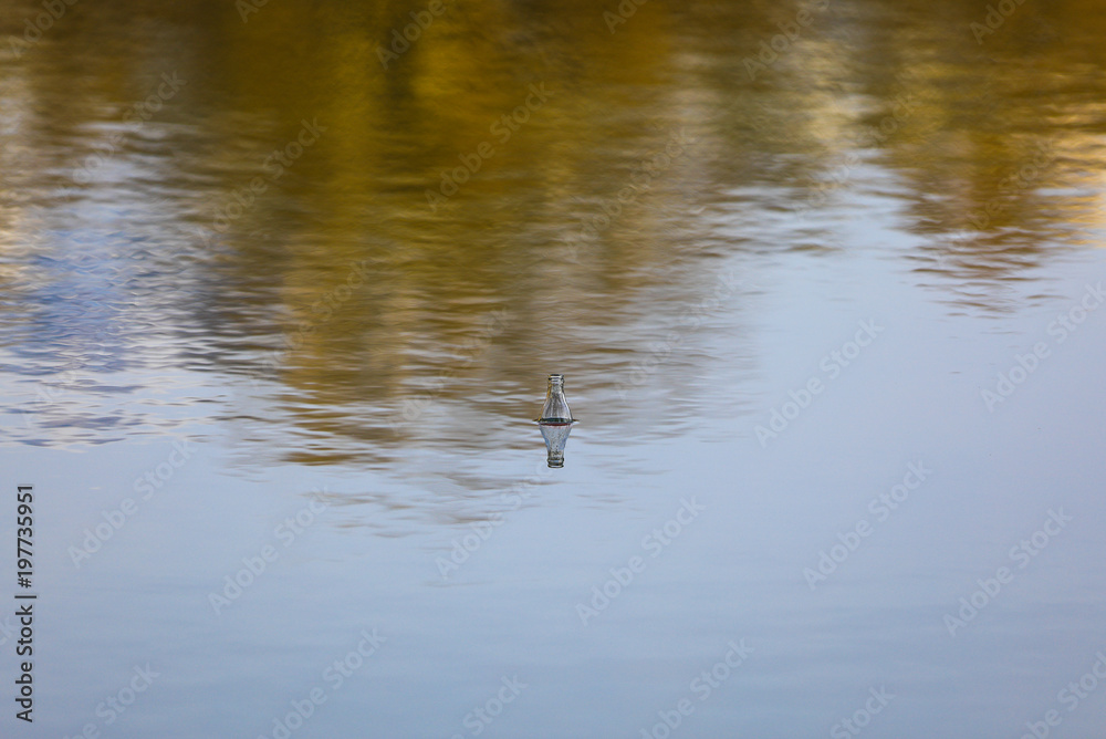 the bottle floats in the water the bottle floats in the water