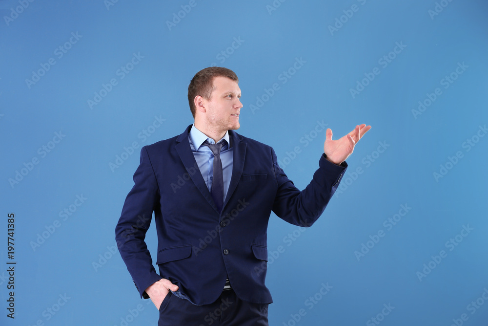 Business trainer explaining seminar on color background Business trainer explaining seminar on color background