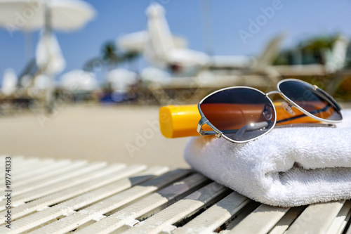 sunglasses and towel. 