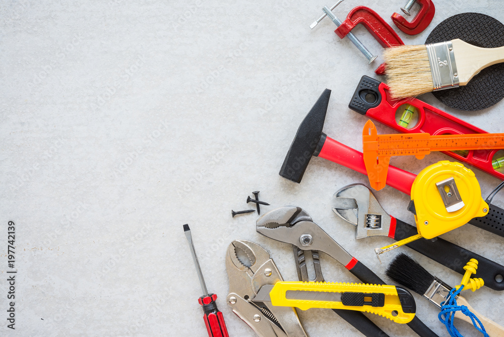 Flat lay, set of construction hardware tools building, repair, painting  accessories on concrete board background with copy space Stock Photo |  Adobe Stock