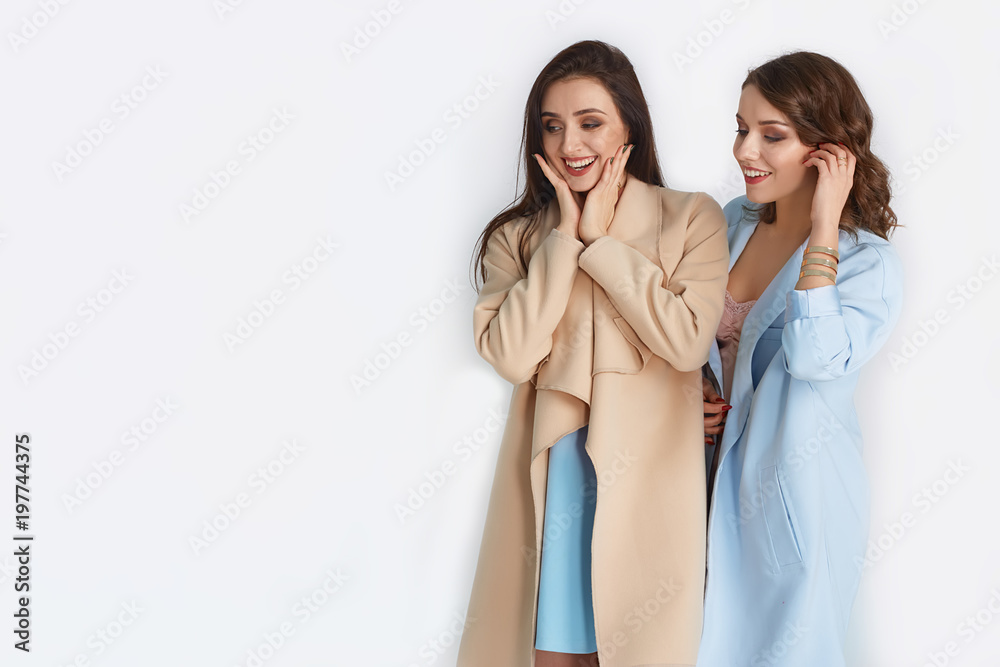 Two beautiful and fashionable women in nice spring dress. Spring concept Two beautiful and fashionable women in nice spring dress. Spring concept
