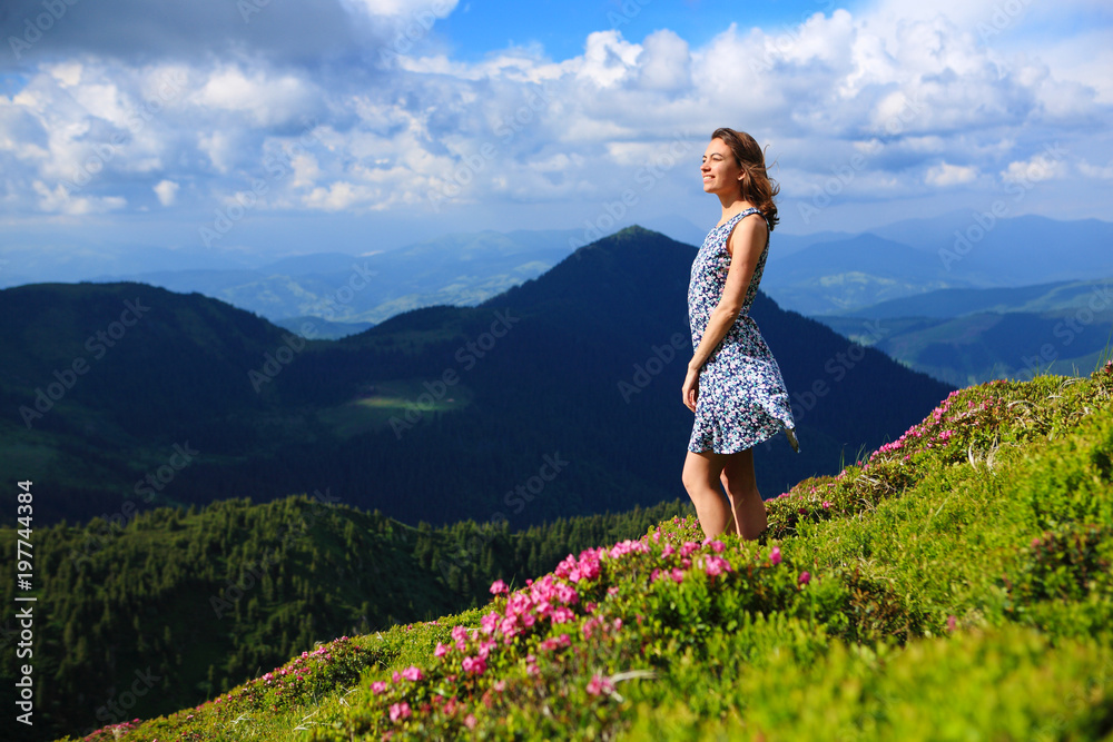 The girl enjoys landscapes in the mountains of the Carpathians.