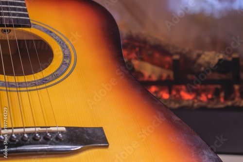 Guitar by the fireplace