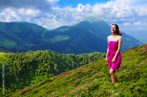 The girl enjoys landscapes in the mountains of the Carpathians.
