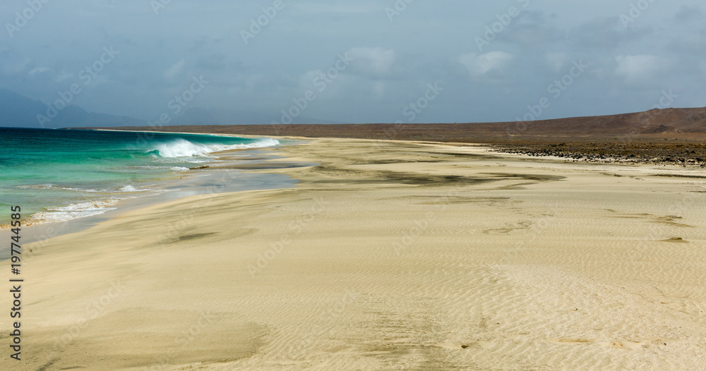Beach on uninhabited cape verde island (cabo verde), Santa Luzia. Strong winds and overcast sky. Beach on uninhabited cape verde island (cabo verde), Santa Luzia. Strong winds and overcast sky.
