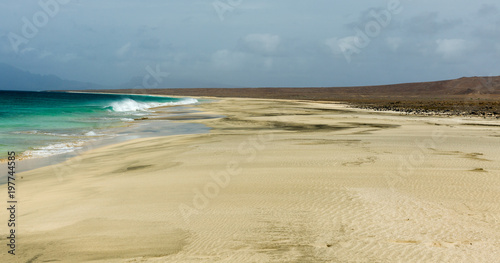 Beach on uninhabited cape verde island  cabo verde   Santa Luzia. Strong winds and overcast sky.