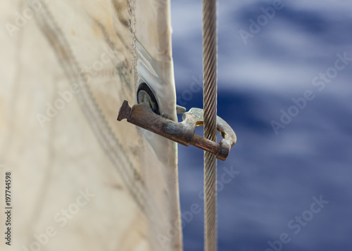 Jib hank (stags) on a forestay, heavely used. Holding a jib.