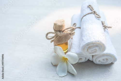 Beautiful spa composition white towel on wooden table.