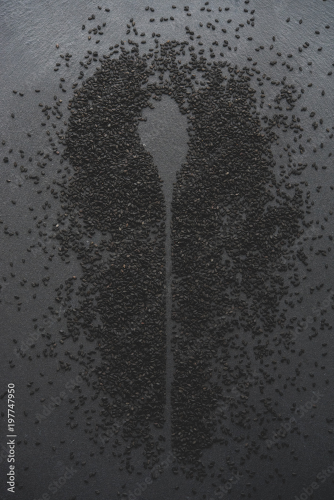 Obraz premium black sesame on wooden spoon
