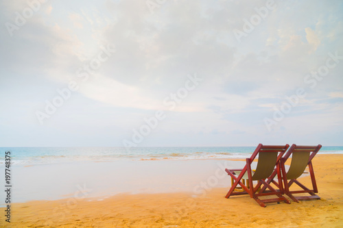 Two beach chairs on the beach. © sandipruel