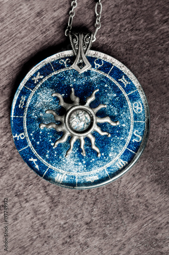 zodiac pendant with astrology signs and sun 