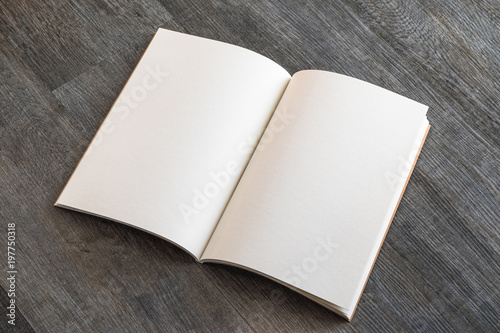 Blank open A4 size book, catalog, magazine, brochure, or booklet mock up template paper texture on brown wood table floor