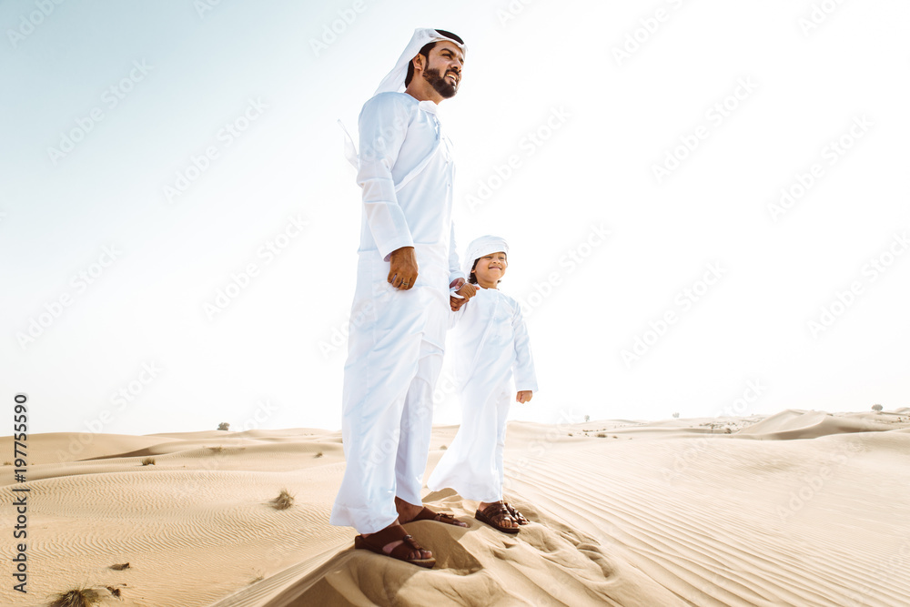 father and son spending time in the desert father and son spending time in the desert