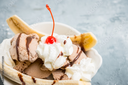 Homemade banana split with on the rustic background. Selective focus. photo