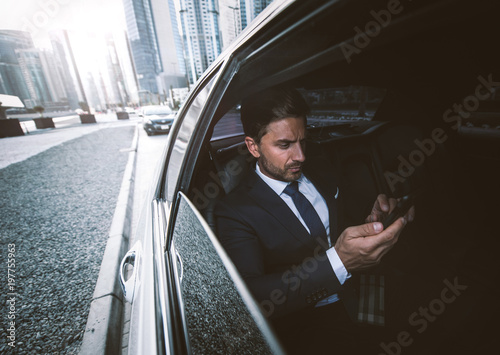 Business man in his limousine Fototapet