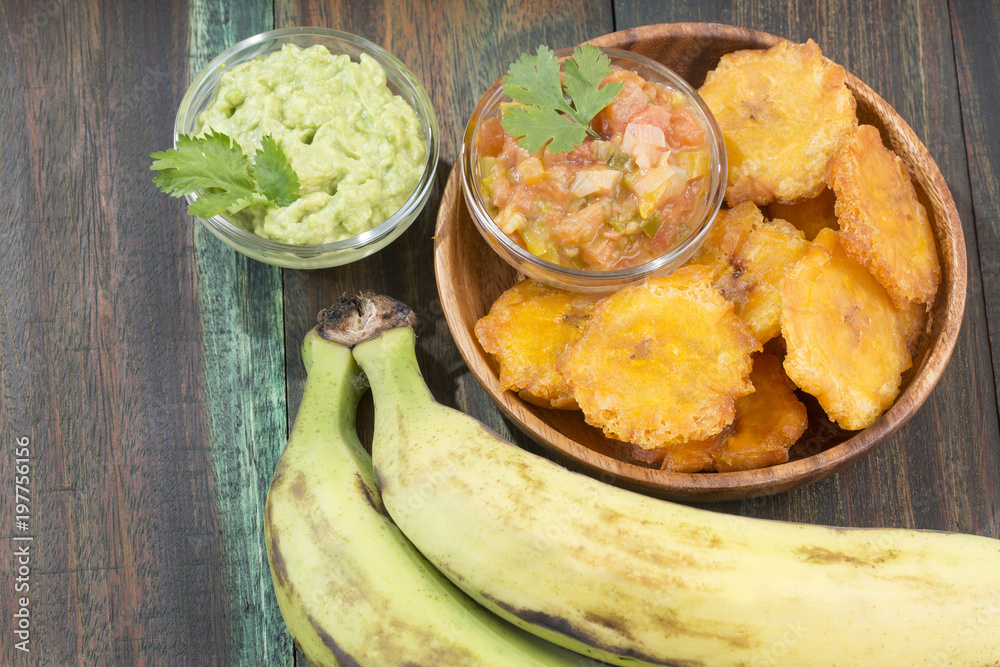 Patacón fried flattened pieces of green plantain (tostón, tachino) Patacón fried flattened pieces of green plantain (tostón, tachino)