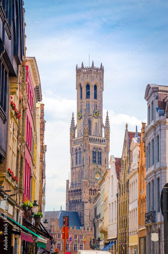 Obraz premium The Belfry Tower (aka Belfort) and traditional narrow streets in Bruges (Brugge), Belgium