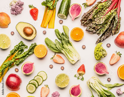 Fototapeta Naklejka Na Ścianę i Meble -  Colorful fruits and vegetables flat lay background with half of oranges,avocado, citrus,apples and berries , top view. Healthy food and clean eating ingredients concept