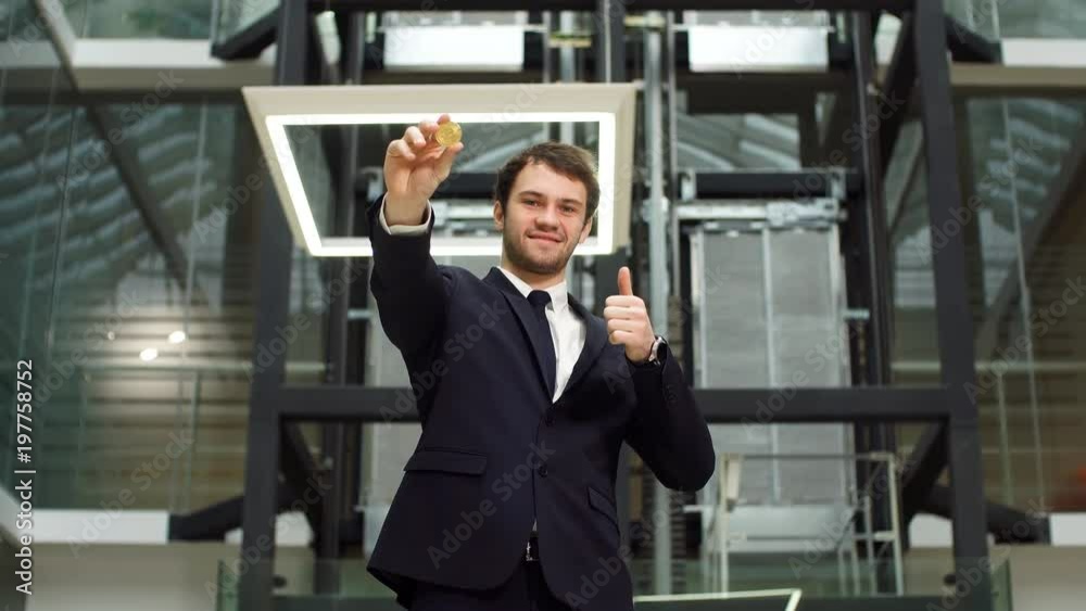 Golden Bitcoin in Caucasian Man Hand. Businessman Holding Digitall Symbol of New Virtual Currency. Golden Bitcoin in Caucasian Man Hand. Businessman Holding Digitall Symbol of New Virtual Currency.
