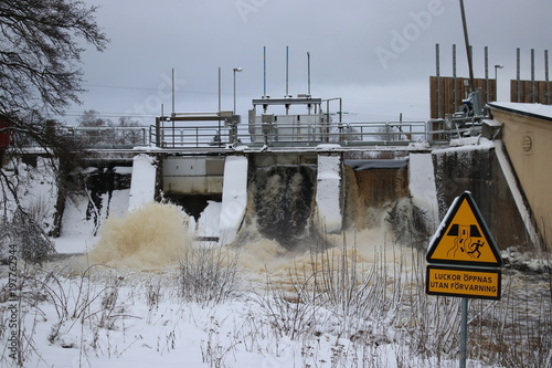 Small hydroelectric dam in southern sweden releases excess water